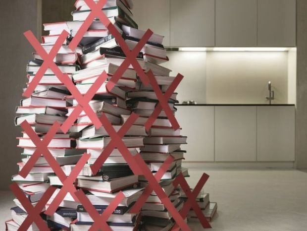 A stack of fad diet books with a red "X" over them, representing the need to avoid extreme or unscientific approaches to nutrition.
