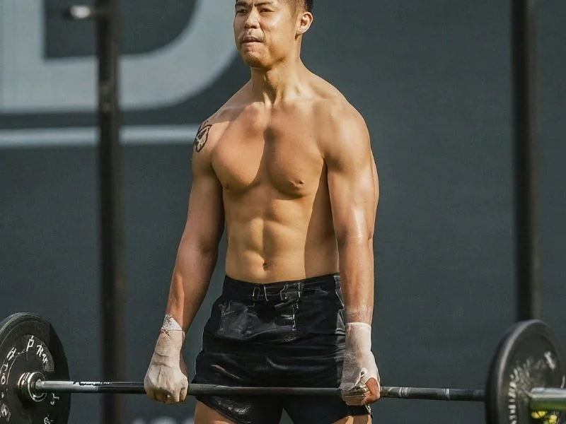 A person lifting weights or doing bodyweight exercises