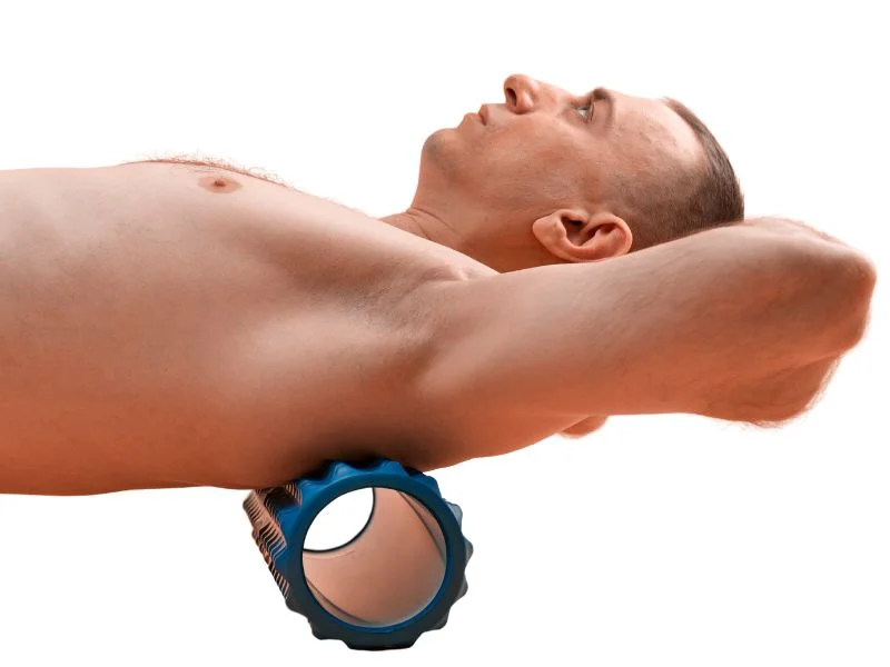 A person using a foam roller for myofascial release