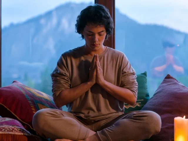 A serene image of a person engrossed in deep breathing meditation