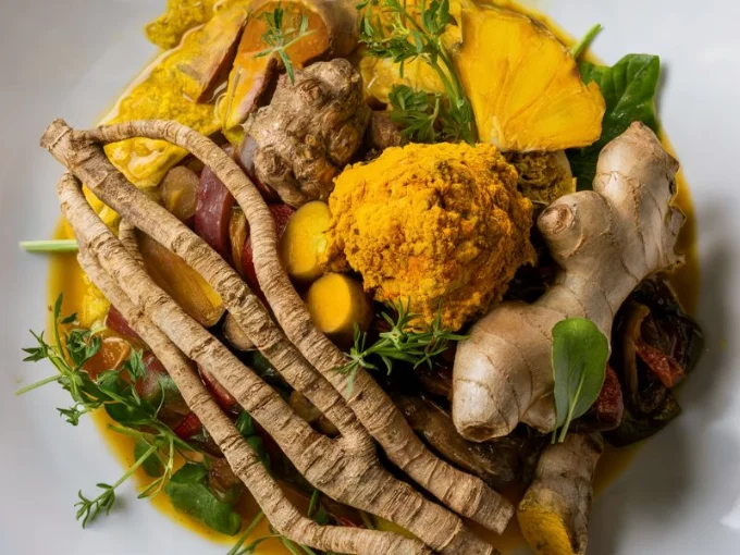 A vibrant and enticing photo of a diverse dish featuring licorice root, turmeric, and ginger