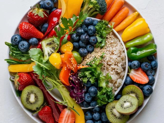 A visually and colorful plate filled with a variety of healthy foods
