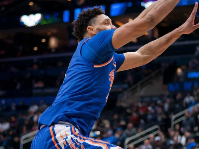 A medium shot of a basketball player in action on the court