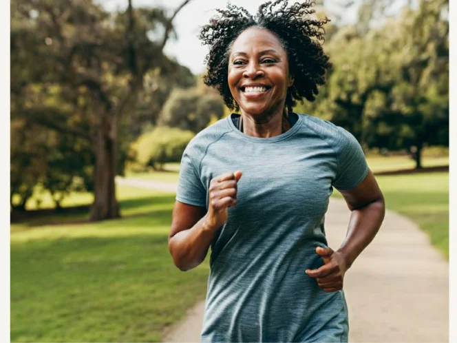 A person jogging in a scenic park, showcasing the joy and energy of cardio exercise