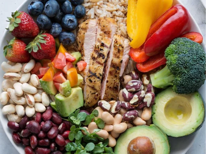 A photo of a vibrant and colorful plate showcasing a balanced meal with various food sources of macronutrients