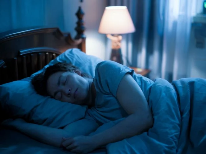 A person sleeping peacefully, emphasizing the importance of rest and recovery