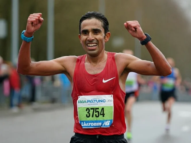 an image of a victorious athlete crossing the finish line or celebrating a personal best, radiating health and vitality