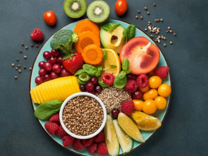 A colorful plate filled with a variety of fruits, vegetables, and whole grains, symbolizing a gut-friendly diet.