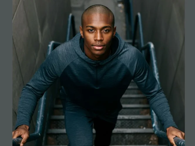 A person confidently performing a functional task, like climbing stairs with ease