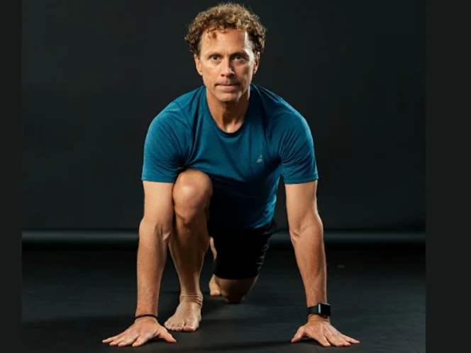 A person performing a forward lunge, showcasing proper alignment and balance
