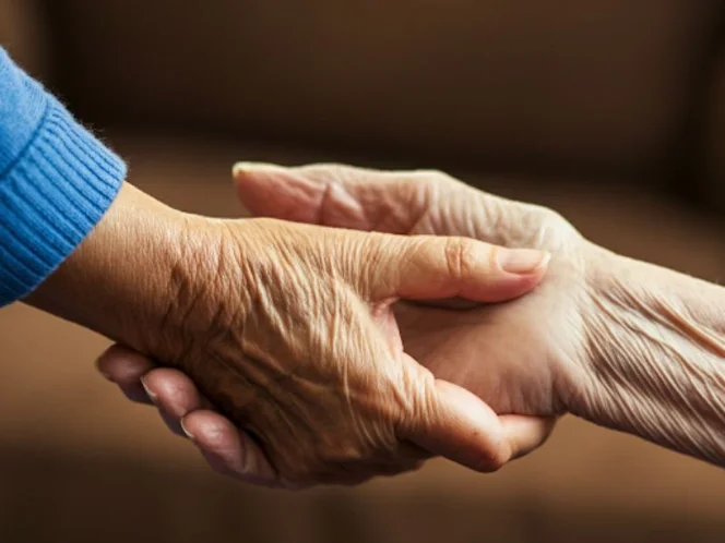 a supportive hand holding another, symbolizing care and hope for those with dementia and Alzheimer's disease