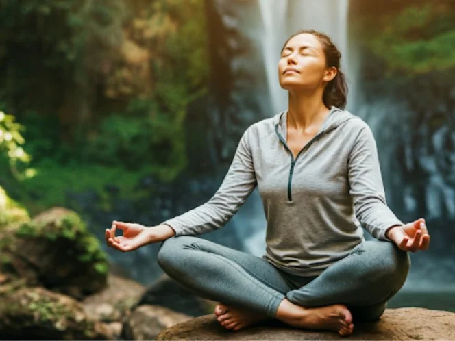an image of a person practicing relaxation techniques, such as deep breathing, and meditation, in a serene environment